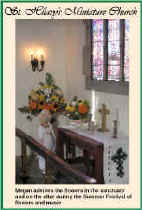 Megan admires the flowers in the sanctuary and on the altar during the Summer Festival of flowers and music