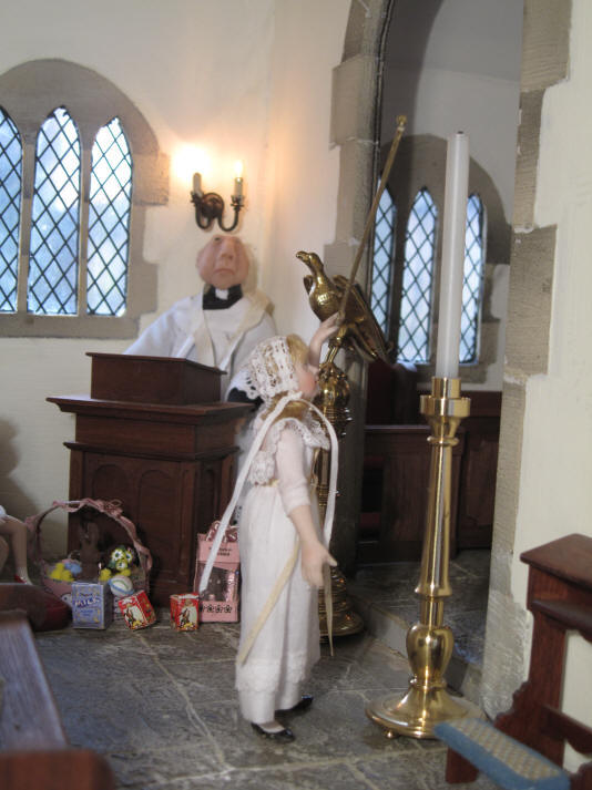 Alice volunteers to light the Paschal candle this year and is just practising to make sure she can reach!