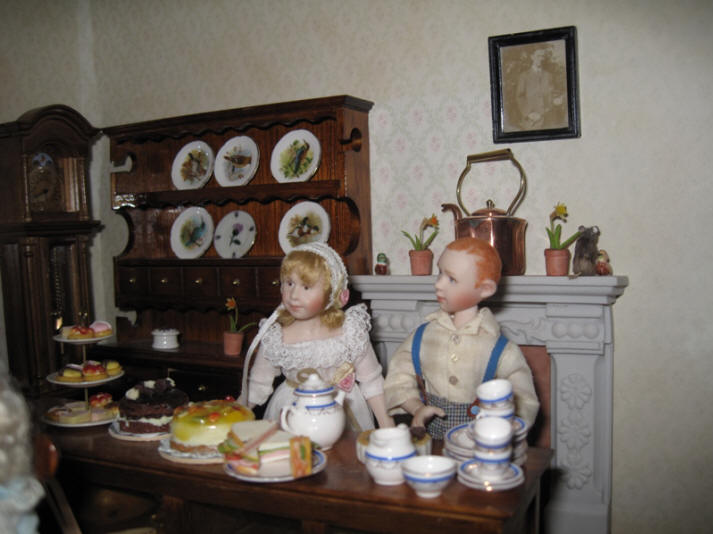 Ambrose and Alice are now ready to set the tables with tea and cakes for the children now they have finished thier work...